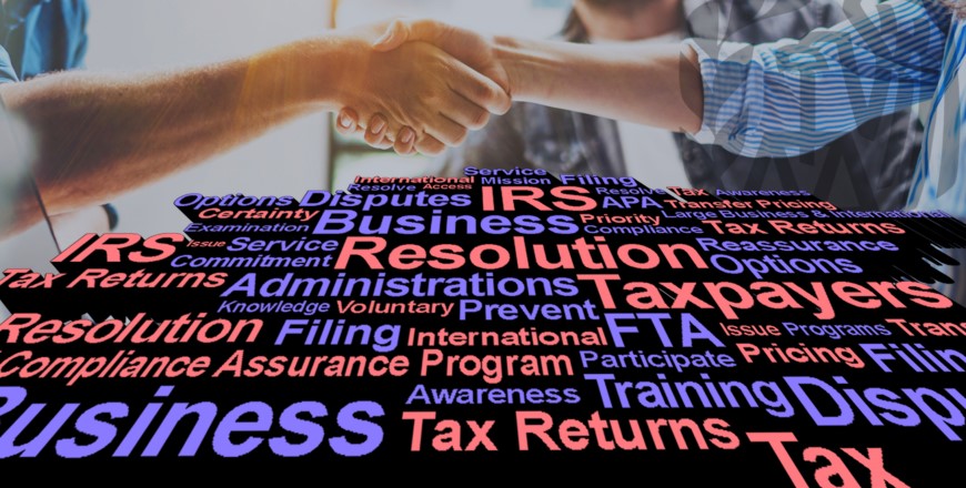 Two people shaking hands over a large amount of words